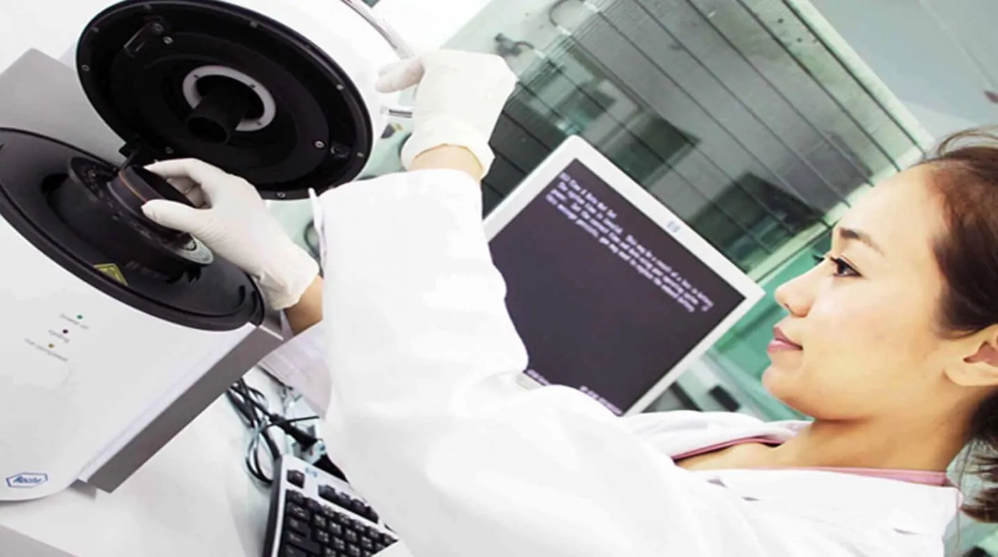 Asian laboratory specialist working inside the Regeneration Center cell laboratory
