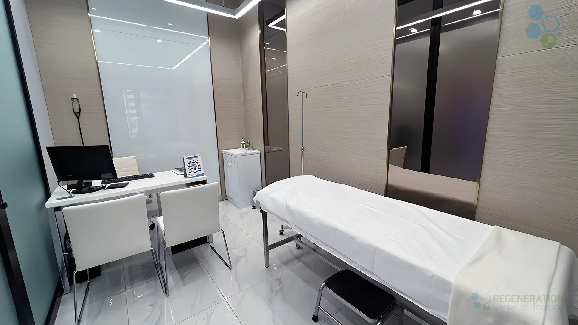 Private care suite with treatment bed and clinical workspace at the Regeneration Center